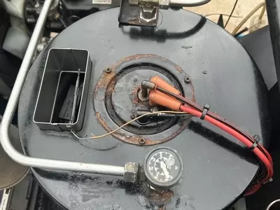 Burner assembly reinstalled on Nilfisk Contractor diesel hot pressure washer after boiler repair.